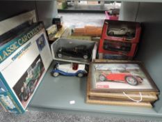Five Burago and similar mixed scale diecast vintage Cars, four boxed, along with decorative Prints