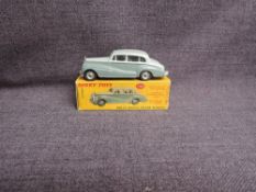 A Dinky diecast, 150 Rolls Royce Silver Wraith, Two Tone Grey in original box, missing end flap