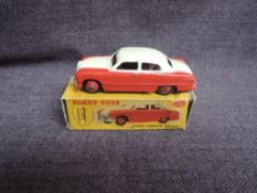 A Dinky diecast, 170 Ford Fordor Sedan, Cream & Red, in original correct spot box