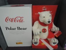 A Limited Edition Steiff Bear, Polar Bear Coca Cola 670336 5675/10000, white tag, display stand,