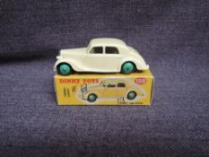 A Dinky diecast, 158 Riley, Cream with Green Hubs, in original correct spot box
