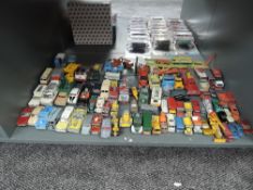 A shelf of playworn diecasts including, Dinky, Corgi, Matchbox Lesney, Matchbox etc