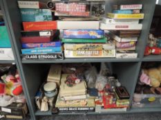 Two shelves of vintage Games and Puzzles including Tank Battle, Class Struggle, Spy Ring,