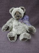 A Charlie Bears Jointed Teddy bear named Sid having plastic eyes, stitched nose and mouth, two