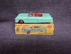 A Dinky diecast, 132 Packard Convertible, Green with Red Hubs, in original box, missing end flaps