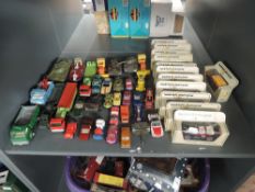 A shelf of playworn and boxed diecasts including Matchbox Lesney, Dinky, Tonka, Matchbox, Models