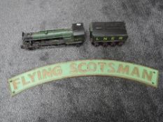 A Reproduction Train Nameplate, Flying Scotsman in green with gold lettering and border along with a