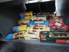 A shelf containing 12 Corgi Classics Limited Edition diecast boxed sets, 20301, 25001, 10201, 22101,
