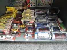 A shelf of modern diecasts including Trackside, Tesco etc, all boxed