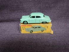 A Dinky diecast, 172 Studebaker Land Cruiser, Light Green in original correct spot box, missing
