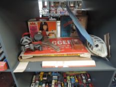 A shelf of vintage Toys and Games including Chad Valley tin plate Soccer, boxed, Singer Little