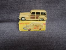 A Dinky diecast, 344 Estate Car, Fawn in original box, missing both end flaps