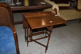 An Edwardian mahogany Sutherland table with slender turned supports. 65CM. X60CM.