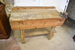 A vintage pine workbench with attached vice to one corner. 81CM X. 122CM.