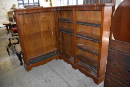 A Victorian corner bookcase, with adjustable material edged shelving, 132CM. X145CM. and 108CM.