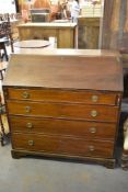 A 19th century mahogany bureau of traditional design with four long cockbeaded drawers, each with