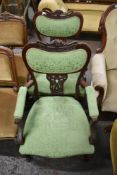 A pair of Edwardian mahogany Art Nouveau armchairs, with shaped, pierced and carved decoration,