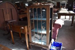 An early 20th century glazed mahogany display cabinet (af) sold alongside a 20th century mahogany