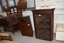 A group of three Edwardian mahogany corner cupboards.