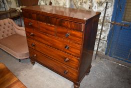 A Victorian mahogany chest of drawers, having blind frieze drawer over three short and three long