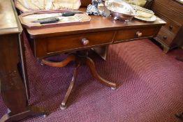 A Victorian mahogany pedestal side table, the rounded rectangular top over two drawers and turned