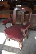 Near pair of late Victorian substantial armchairs. upholstered in Burgundy leatherette material