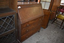 An early 20th century oak bureau of traditional arrangement. 108CM. X. 93CM.