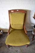 A late Victorian oak easychair, with incised decoration and turned and moulded legs. Seat height