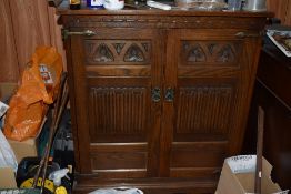 An Old Charm oak linenfold television cabinet. 96CM. X. 80CM.