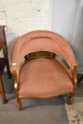 An Edwardian mahogany tub form armchair. Partially upholstered in pink draylon. Seat height 35CM.