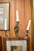 A gilt brass theee branch wall sconce.