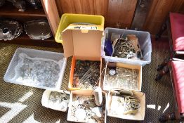 A large quantity of various miscellanious clock parts, furniture fittings, glass lustre drops, and