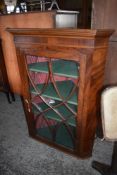 A George III glazed figured mahogany cupboard of traditional design, 112CM.