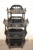 A Victorian Ebonised wood four tier whatnot, having incised decoration highlighted in gilt. 136CM.