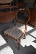 A set of four 1920s mahogany Queen Anne style dining chairs sold along with a Victorian mahogany