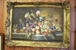A large 20th century oil on canvas, still life study of fruit, within an ornate moulded gilt
