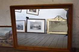 A large modern pine wall mirror. 107CM. X 138CM.
