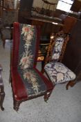 A Victorian upholstered nursing chair, having needlework foliate central stripe. Seat height.