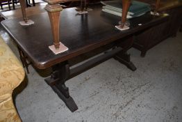 A 20th century stained oak refectory type table. 74CM. X. 156CM. Table covers included.