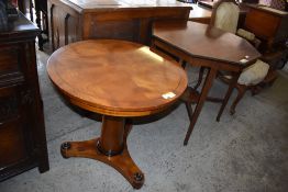 An Edwardian inlaid mahogany octagonal table, sold along with a Victorian circular pedestal table