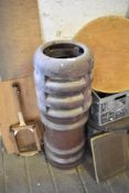 A salt glazed chimney pot of vented cylindrical form, marked I.K 101 CM