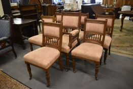 A set of seven Victorian mahogany salon chairs comprising a gentleman's armchair and six single