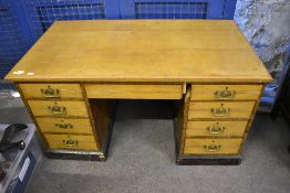 A Victorian light oak pedestal desk, of traditional form with rectangular top over central drawer