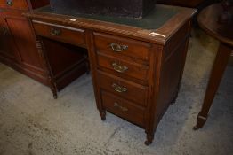 A small Victorian oak kneehole desk, the top with moulded edge detail over single drawer with