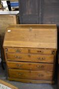 A 19th century light oak bureau of traditional design, some repairs and replacements. 116CM.
