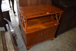 A modern reproduction yewwood cabinet. 79CM. X. 71CM