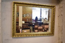 Modern gilt frame rectangular wall mirror.