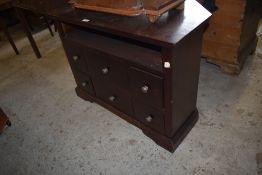 A modern stained mahogany television cabinet with six drawers. 62CM. X 83CM.
