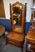 A reproduction mahogany Cheval mirror, the oblong plate with shaped surround between barley twist