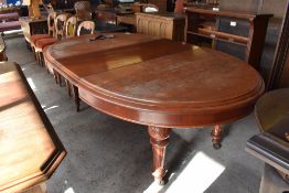 Victorian mahogany extending dining table, of rounded oblong form with moulded edge detail over